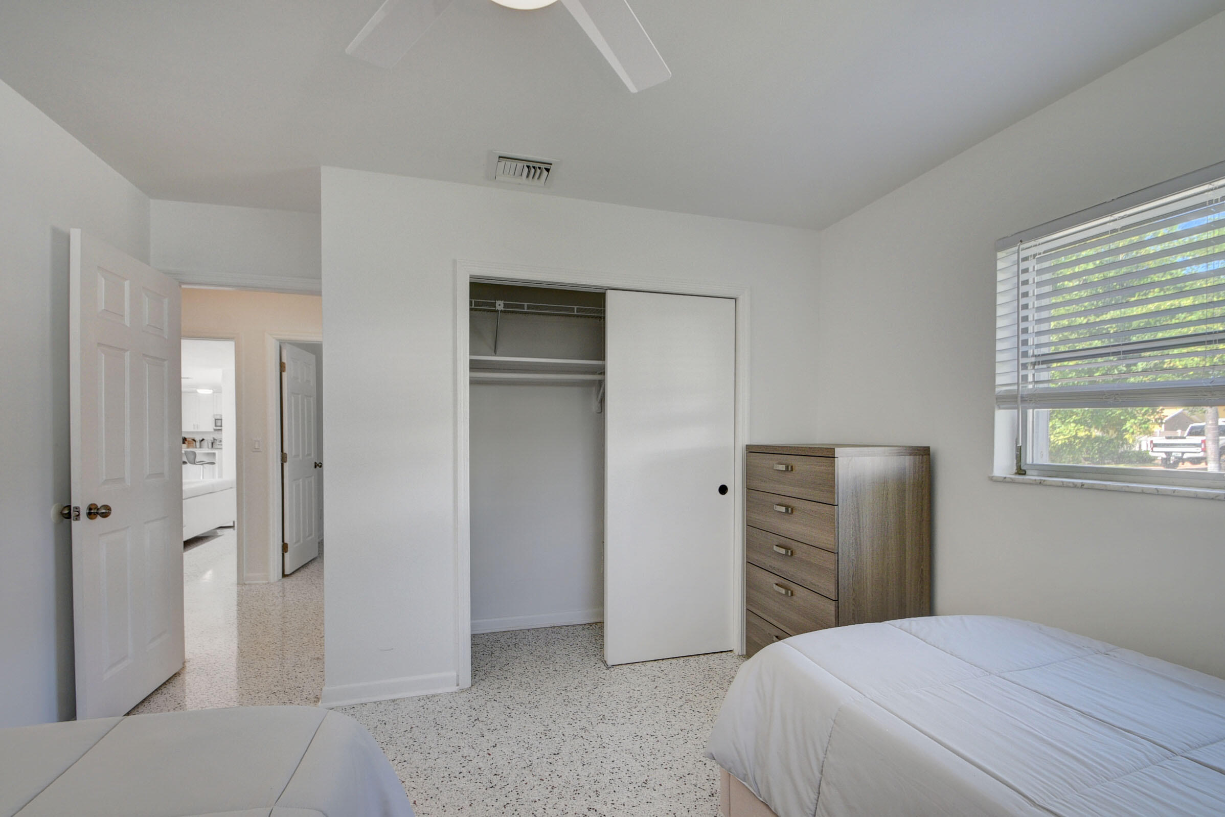 1171 Bimini Lane Singer Island, FL 33404 - Photo 25 of 61 a bedroom with a bed and a closet
