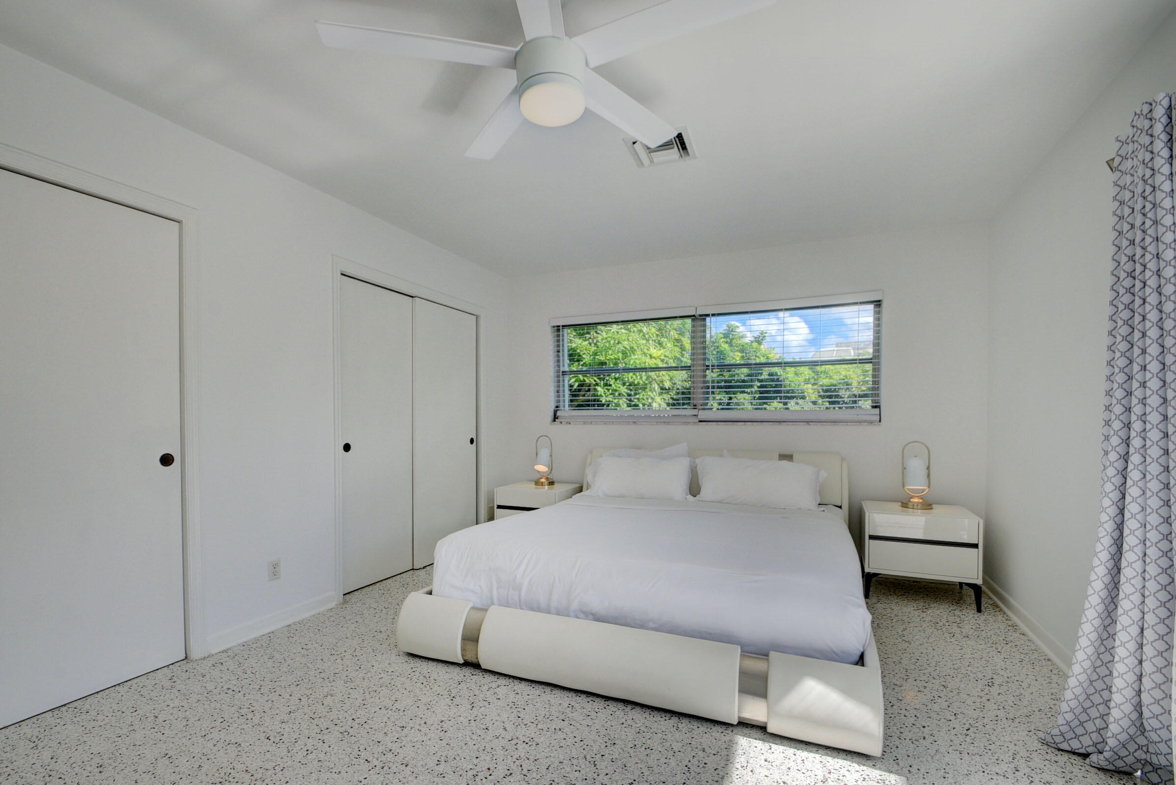 1171 Bimini Lane Singer Island, FL 33404 - Photo 26 of 61 a bedroom with a bed and a window