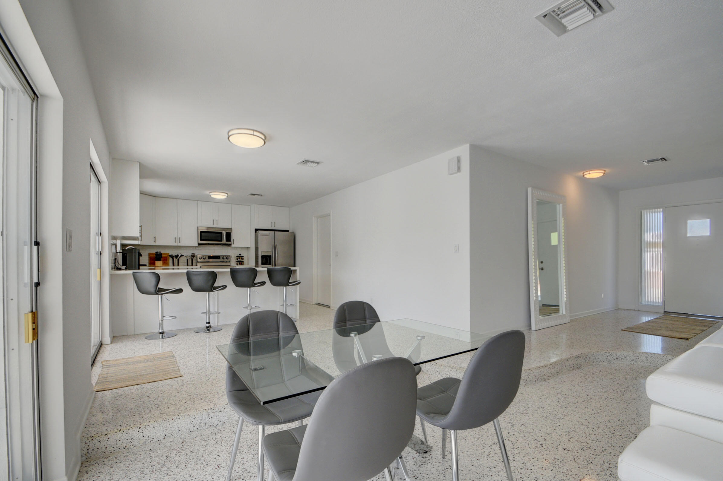 1171 Bimini Lane Singer Island, FL 33404 - Photo 27 of 61 a living room with furniture and a view of kitchen