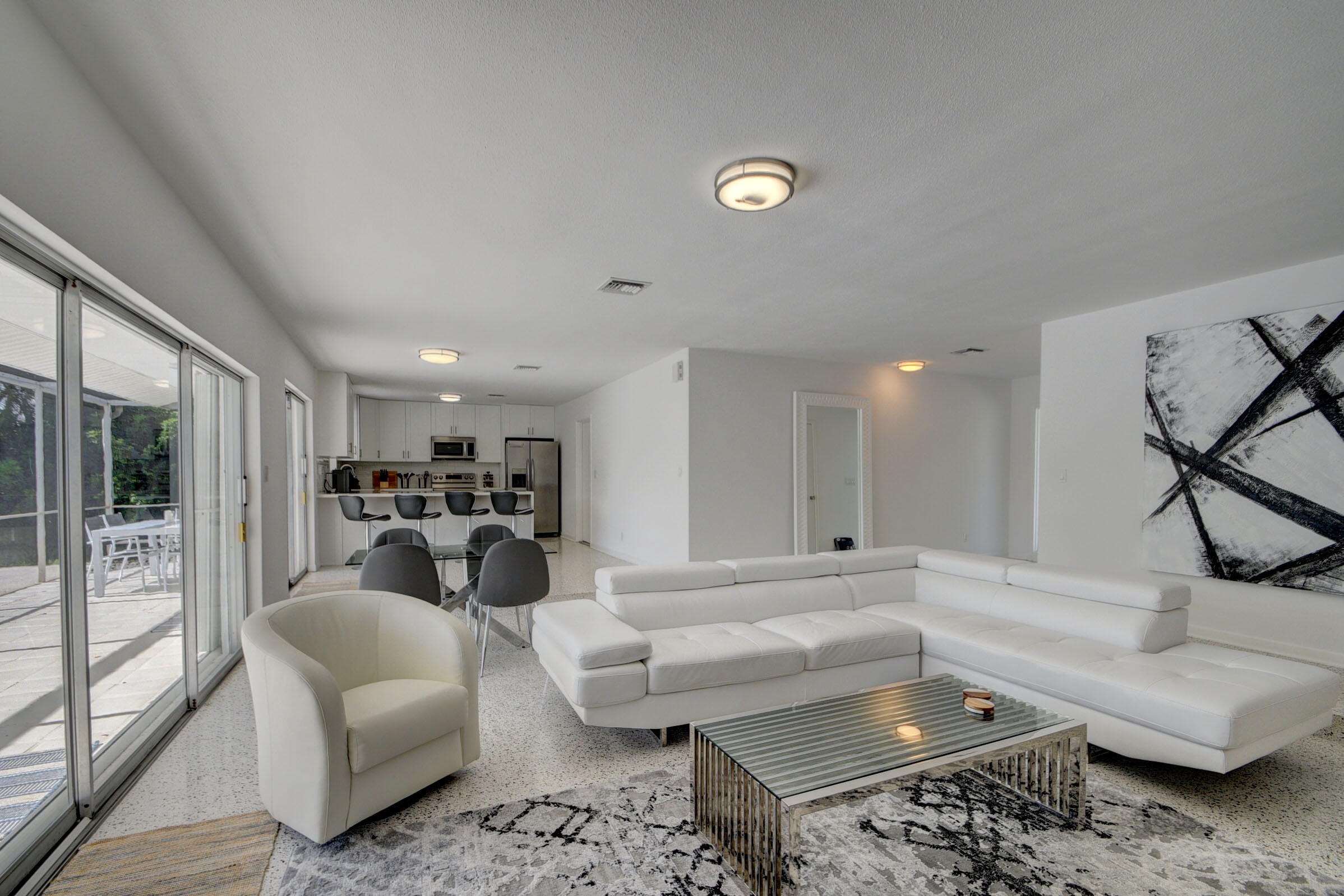 1171 Bimini Lane Singer Island, FL 33404 - Photo 29 of 61 a living room with furniture and a couch