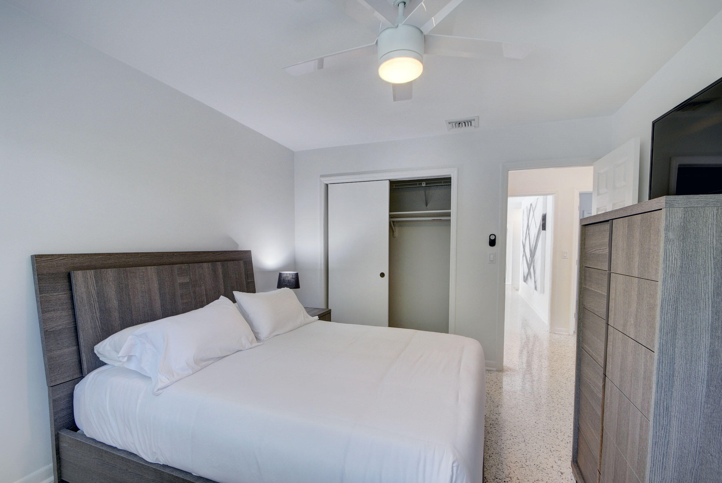 1171 Bimini Lane Singer Island, FL 33404 - Photo 34 of 61 a bed room with a bed and a tv