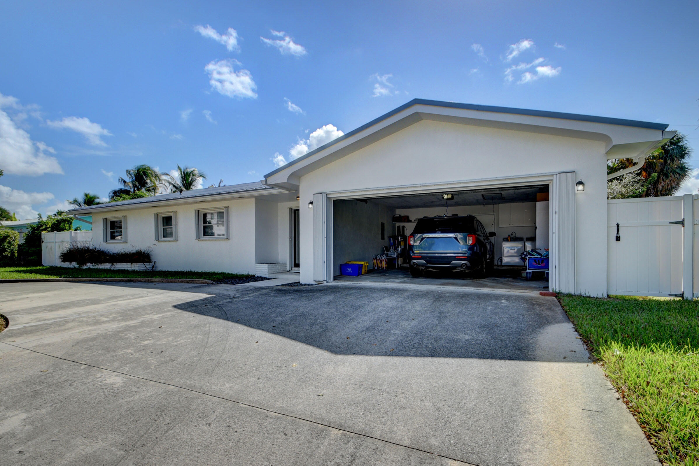 1171 Bimini Lane Singer Island, FL 33404 - Photo 36 of 61 a view of a car park in front of house