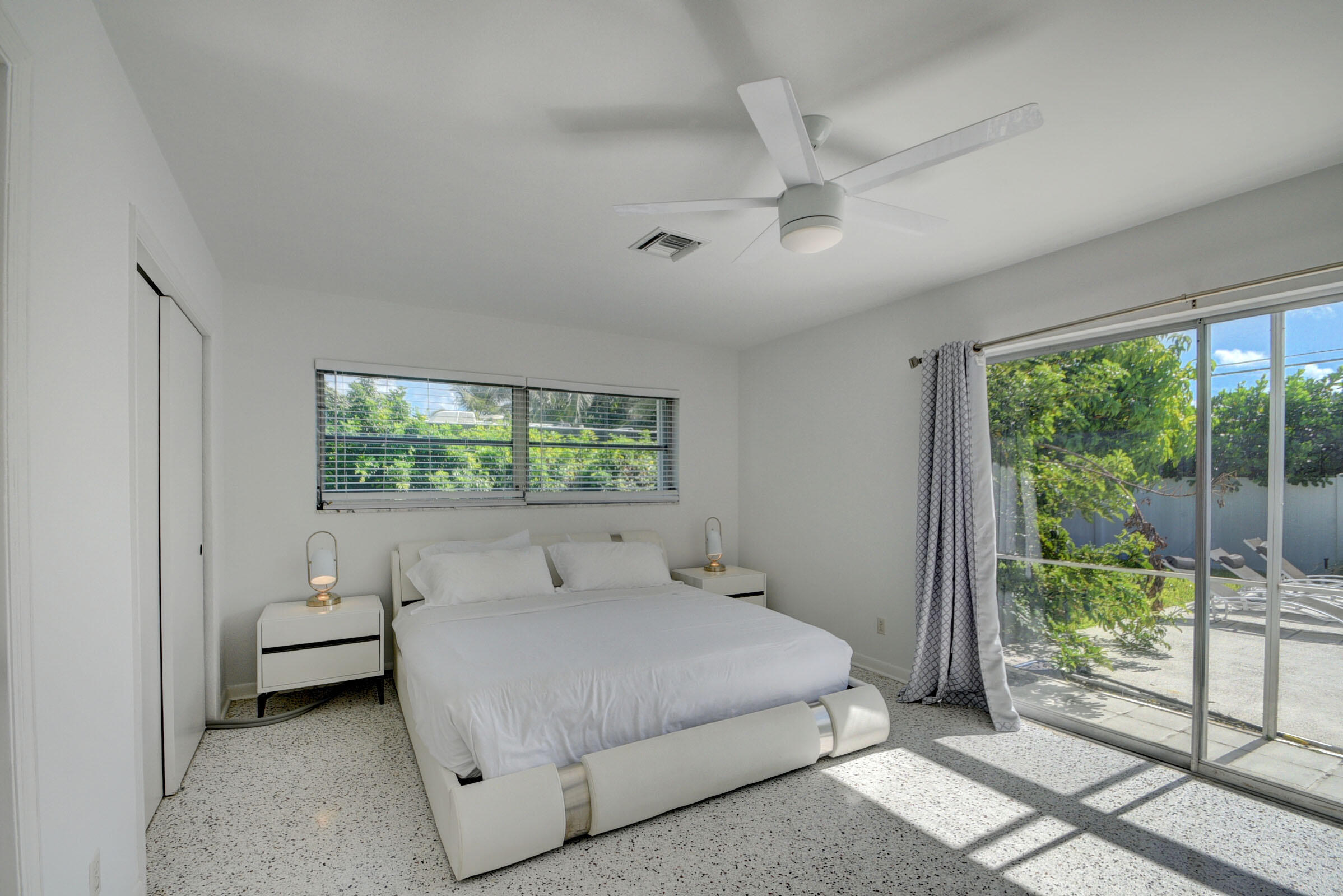 1171 Bimini Lane Singer Island, FL 33404 - Photo 40 of 61 a bedroom with a bed and a window