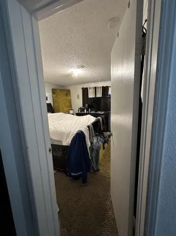 a bed room with a bed and a mirror