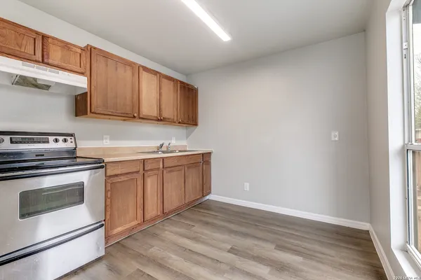 a kitchen with sink cabinets and stainless steel appliances