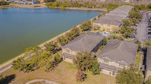 an aerial view of a house with a ocean view