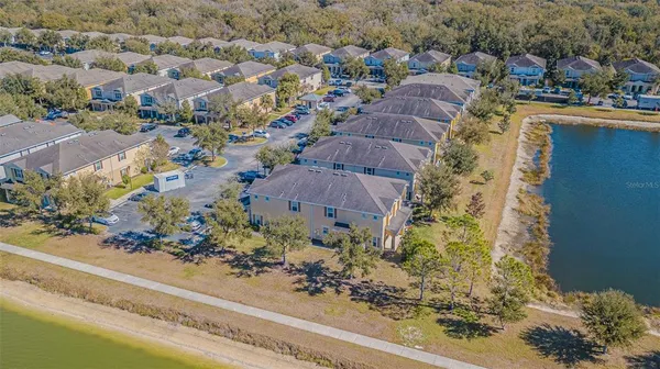 an aerial view of lake residential house with outdoor space