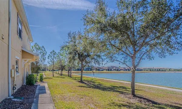 a view of a swimming pool with an outdoor seating