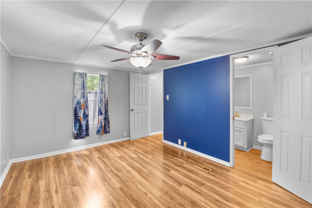 169 West Bagwell Road Liberty, SC 29657 - Photo 28 of 29 Well-lit sleeping quarters featuring durable wood flooring and an attached private bath.