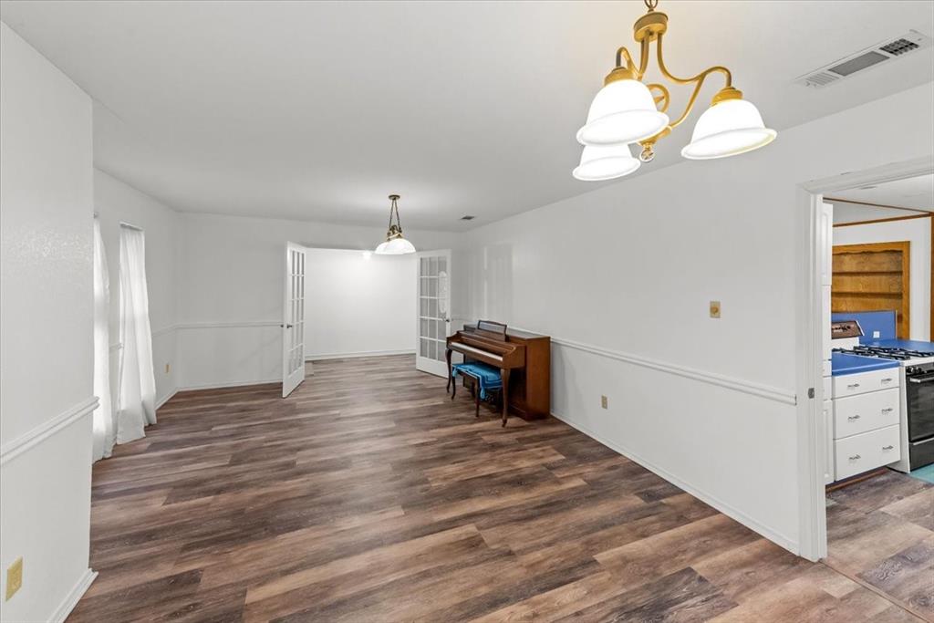 1812 Trinity Drive Waco, TX 76710 - Photo 16 of 24 a view of a room with wooden floor