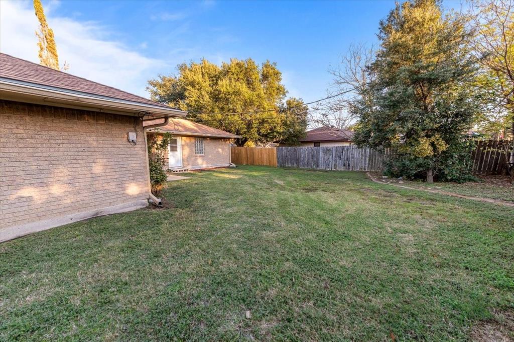 1812 Trinity Drive Waco, TX 76710 - Photo 22 of 24 a view of a backyard of the house