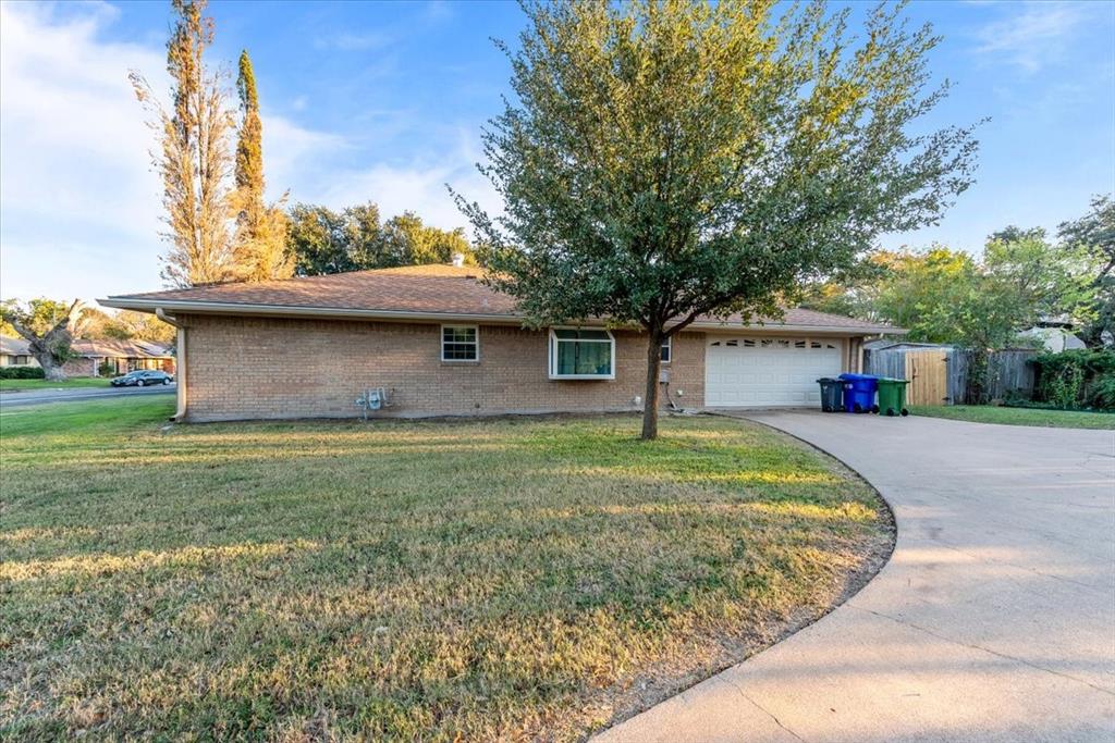 1812 Trinity Drive Waco, TX 76710 - Photo 23 of 24 a house view with a garden space