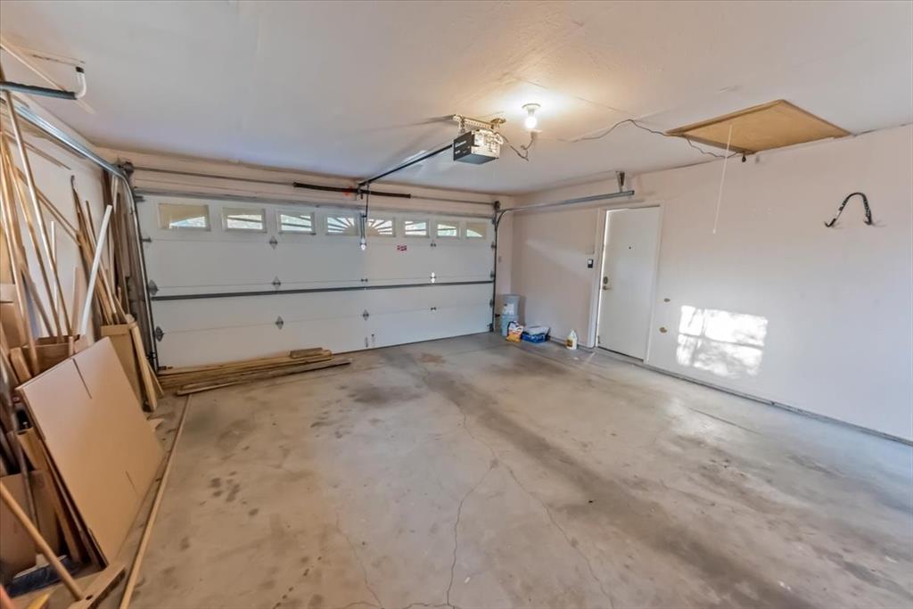 1812 Trinity Drive Waco, TX 76710 - Photo 24 of 24 en empty room with wooden floor and windows