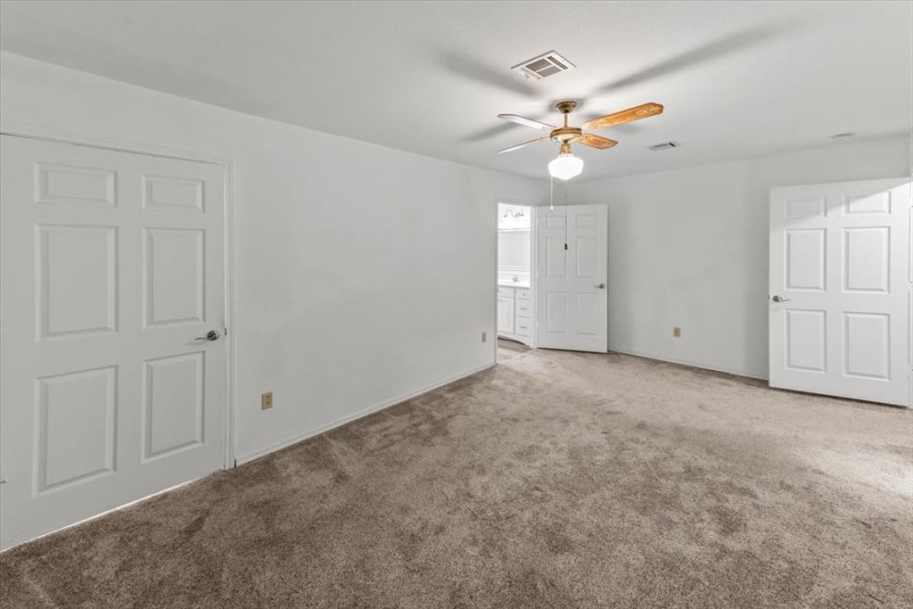 1812 Trinity Drive Waco, TX 76710 - Photo 3 of 24 an empty room with closet and a ceiling fan