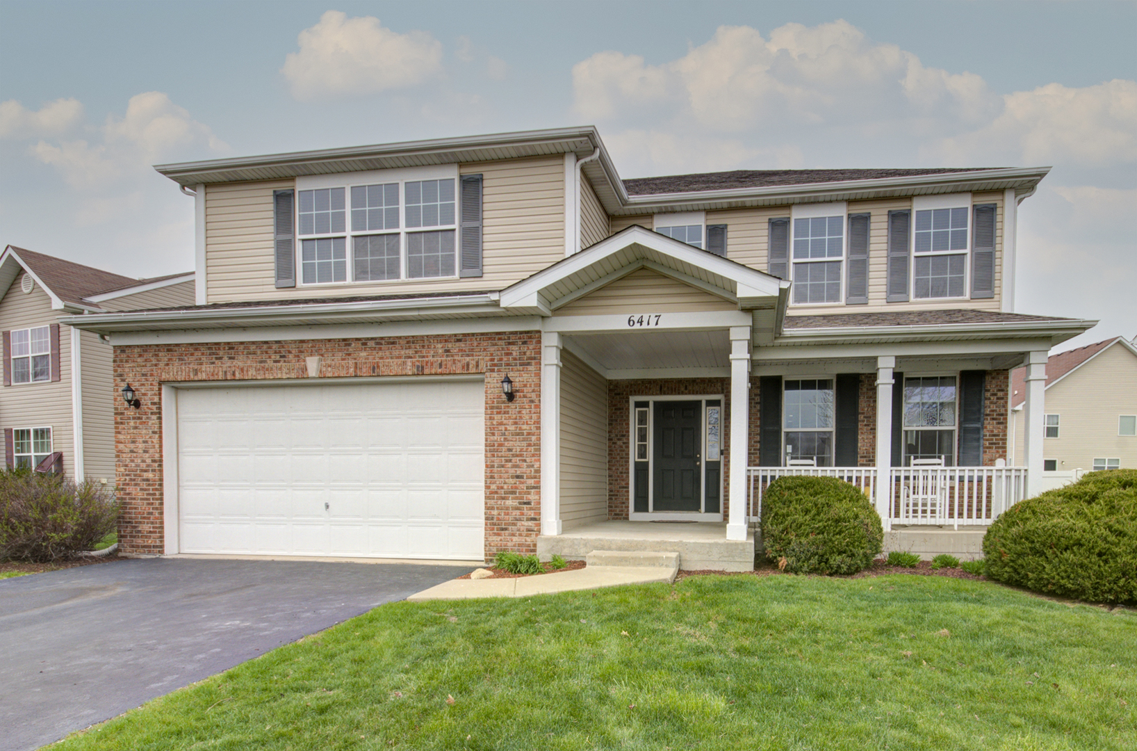 6417 Roth Drive Joliet, IL 60431 - Photo 1 of 32 a front view of a house with a yard and garage