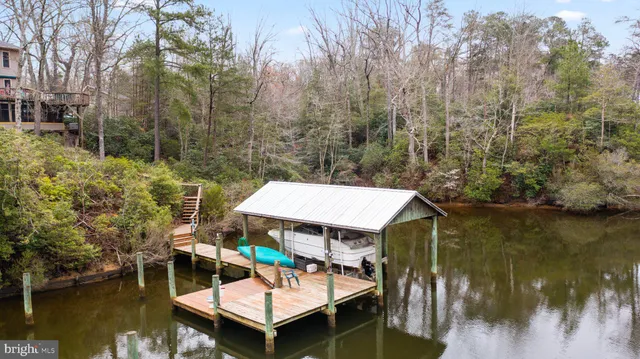 a small view of a lake with a yard and sitting area