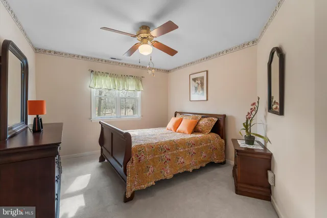 a bathroom with a sink a toilet and a shower curtain