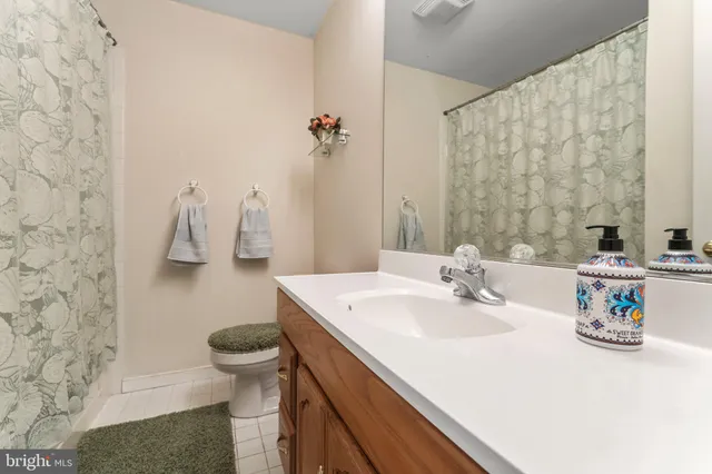 a bedroom with two beds and a window