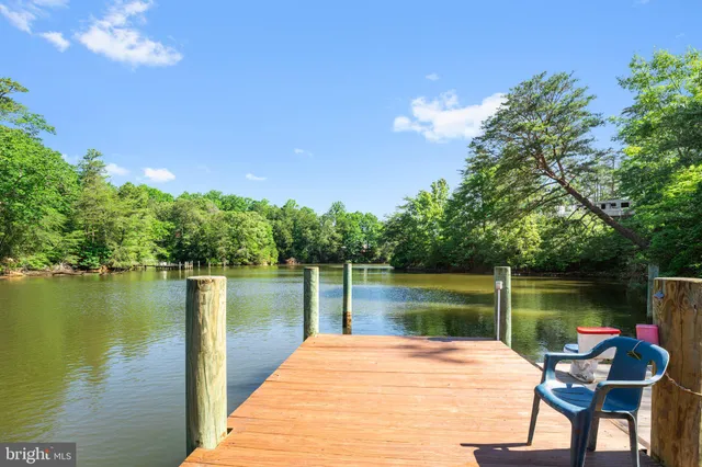 a lake view with a wooden fence and lake view
