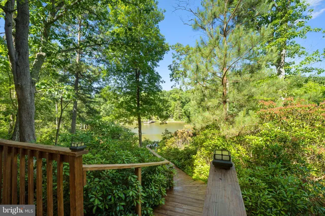 swimming pool view with a seating space