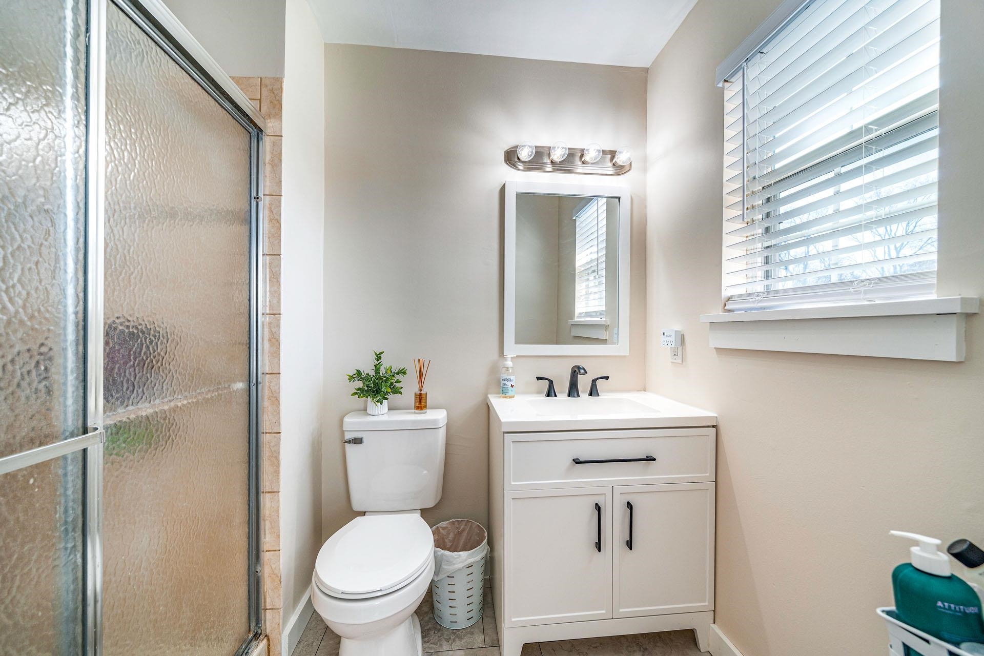 656 Stagecoach Road Marmora, NJ 08223 - Photo 24 of 45 a bathroom with a toilet a sink and a mirror