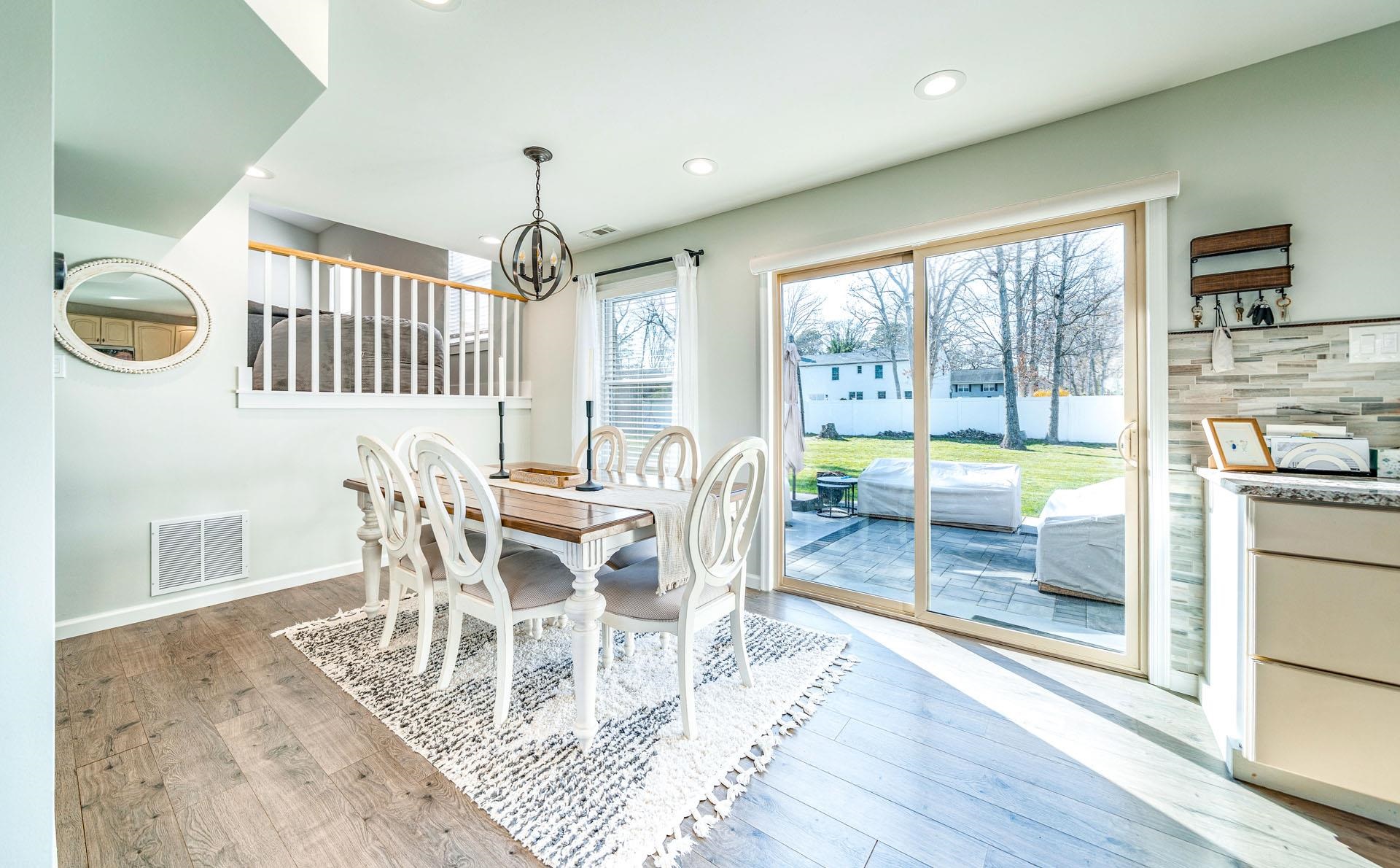 656 Stagecoach Road Marmora, NJ 08223 - Photo 10 of 45 a view of a dining room with furniture wooden floor and a chandelier