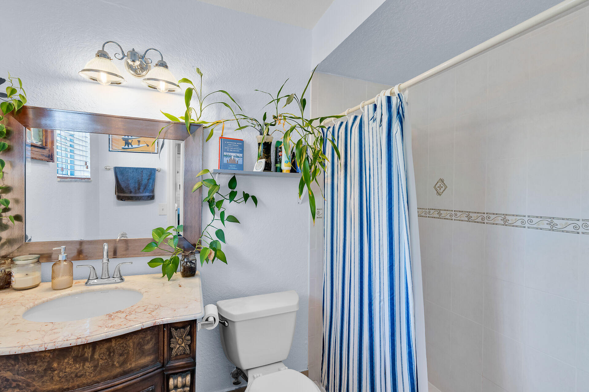 64 Coconut Drive Key Largo, FL 33037 - Photo 29 of 44 a bathroom with a sink a toilet and shower