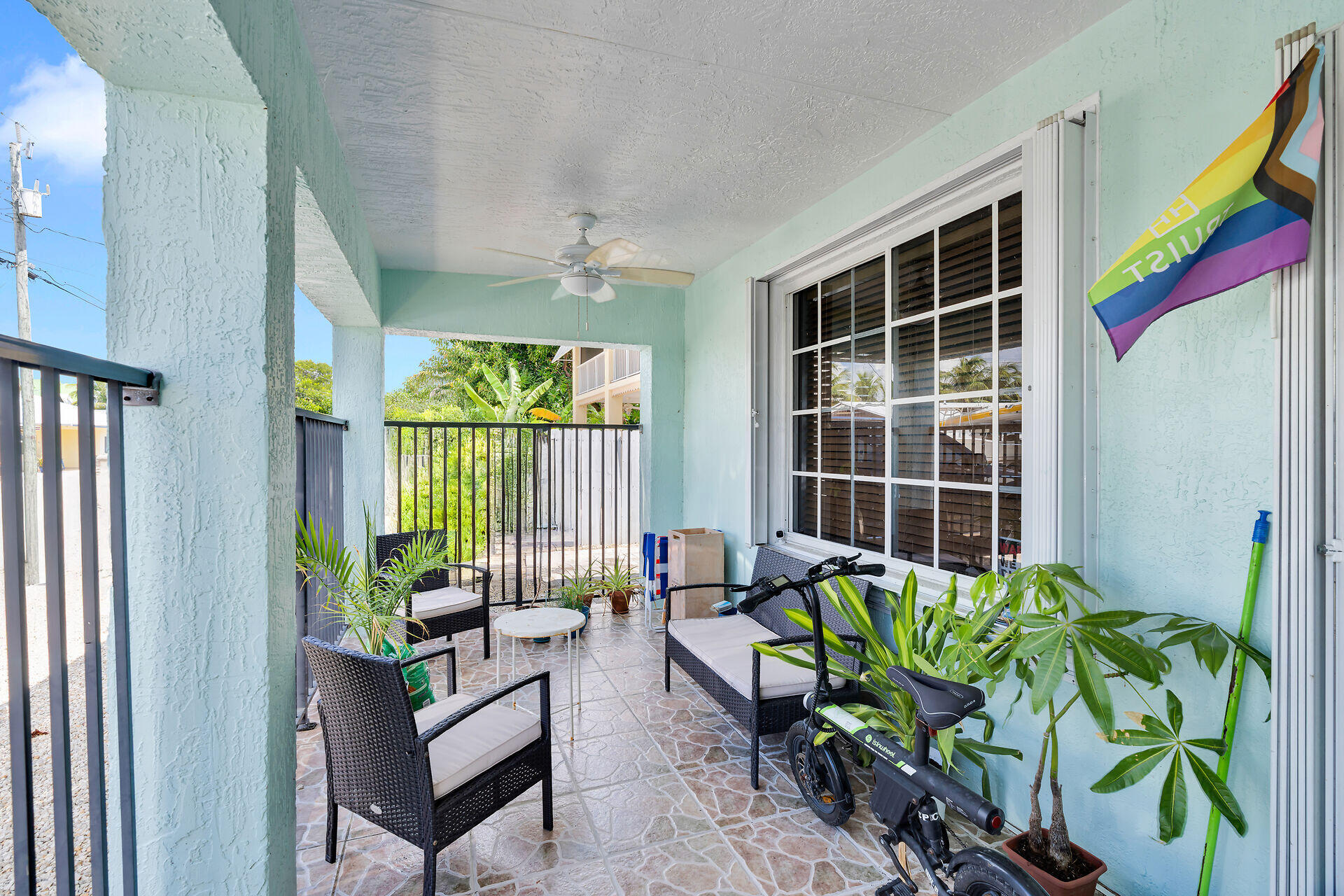 64 Coconut Drive Key Largo, FL 33037 - Photo 4 of 44 a living room filled with furniture and a potted plant