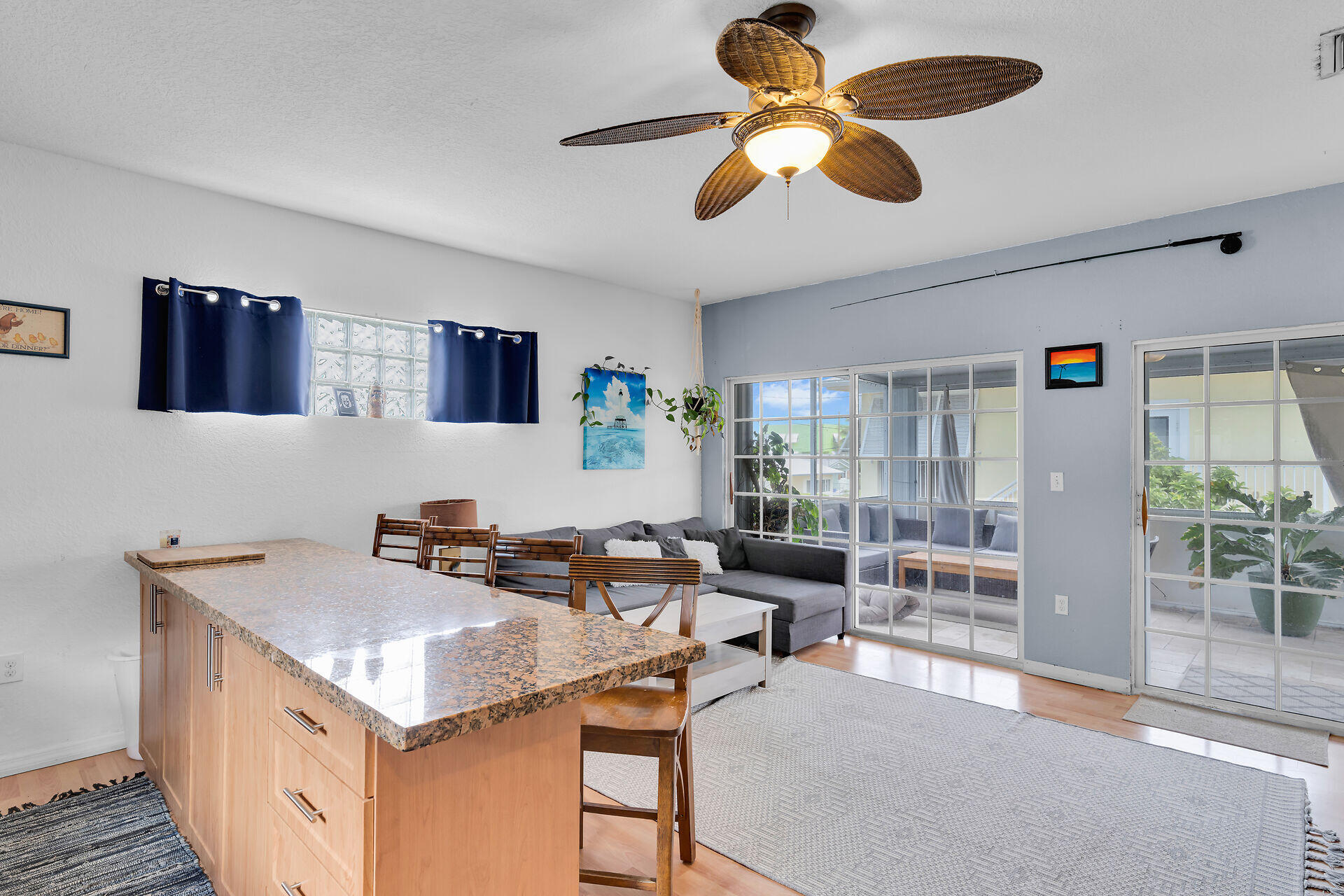 64 Coconut Drive Key Largo, FL 33037 - Photo 8 of 44 a kitchen with a table chairs and a ceiling fan