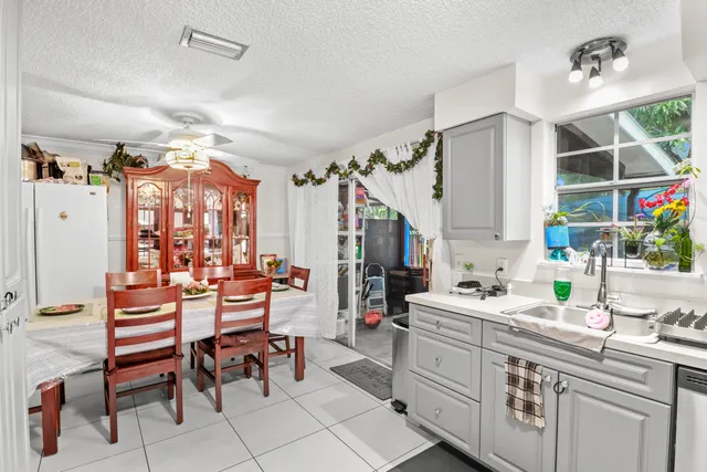 a kitchen with stainless steel appliances a refrigerator sink and cabinets