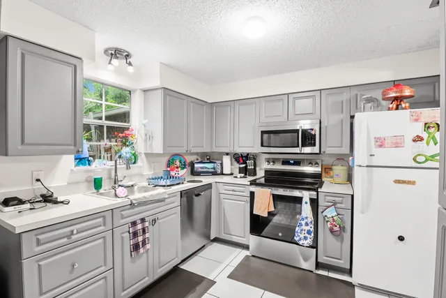 a open kitchen with furniture and a breakfast area