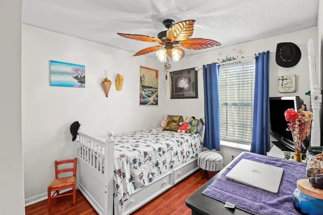 a bedroom with a bed and dresser