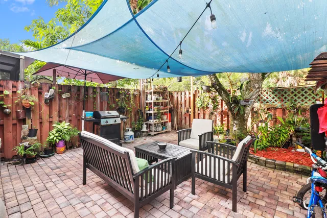 a outdoor living space with patio furniture and a potted plant