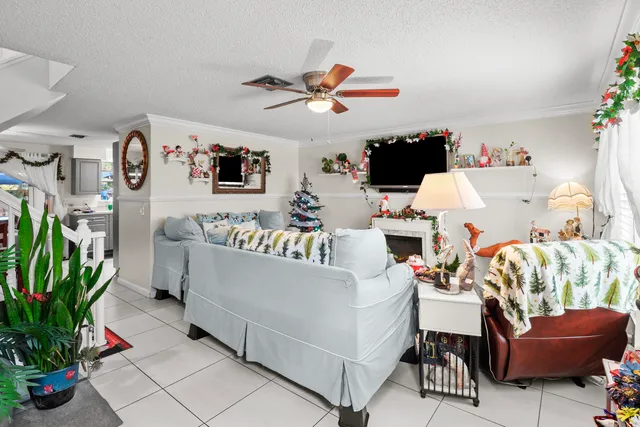 a view of a hallway with paintings on the wall