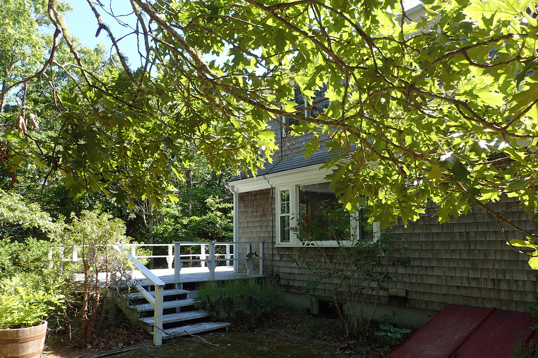 5 Blackfish Road Truro, MA 02666 - Photo 11 of 21 a view of a house with backyard sitting area and garden