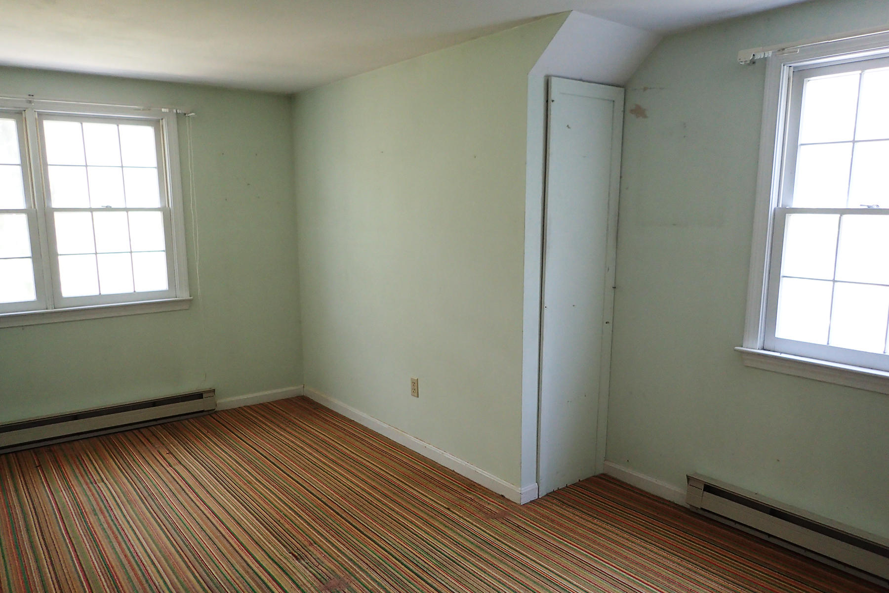 5 Blackfish Road Truro, MA 02666 - Photo 16 of 21 an empty room with wooden floor and windows