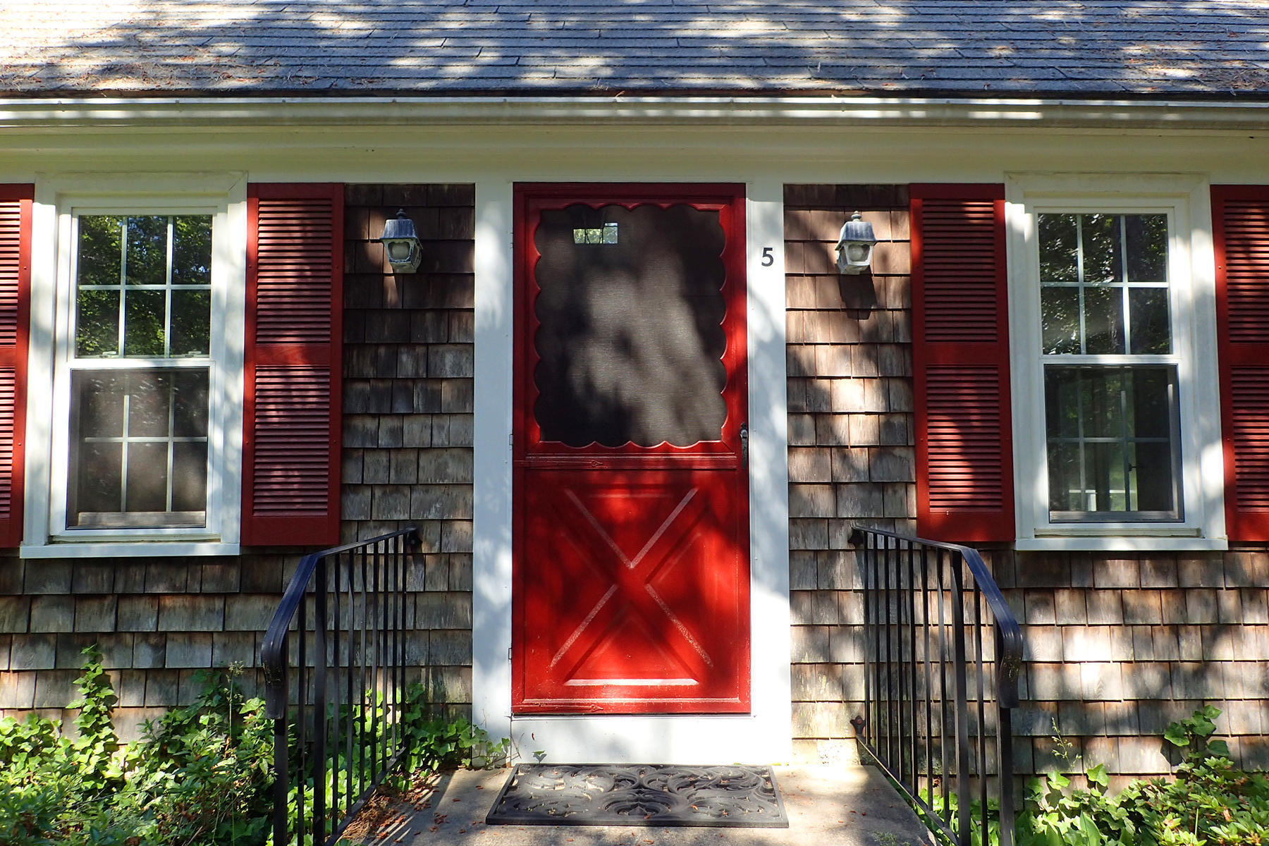 5 Blackfish Road Truro, MA 02666 - Photo 2 of 21 a front view of a house with a entryway