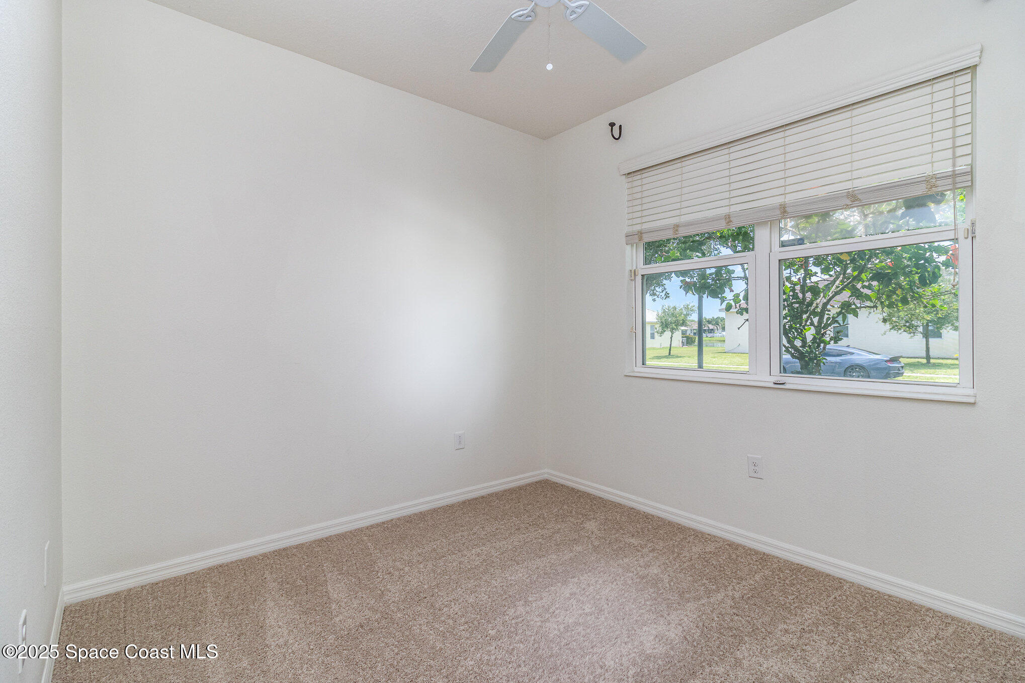 122 Port Royal Court Sebastian, FL 32958 - Photo 11 of 26 an empty room with a window