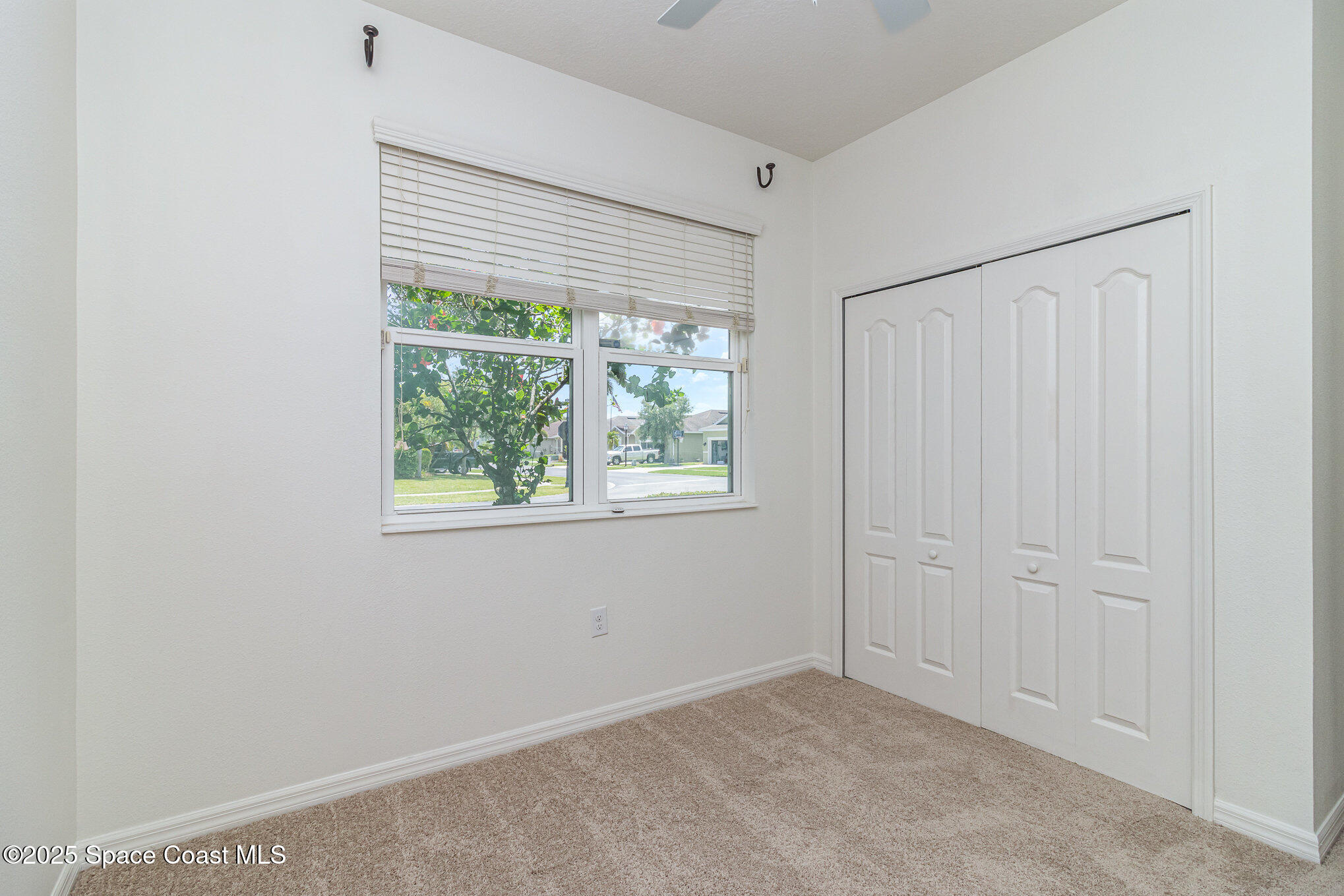 122 Port Royal Court Sebastian, FL 32958 - Photo 12 of 26 an empty room with a window