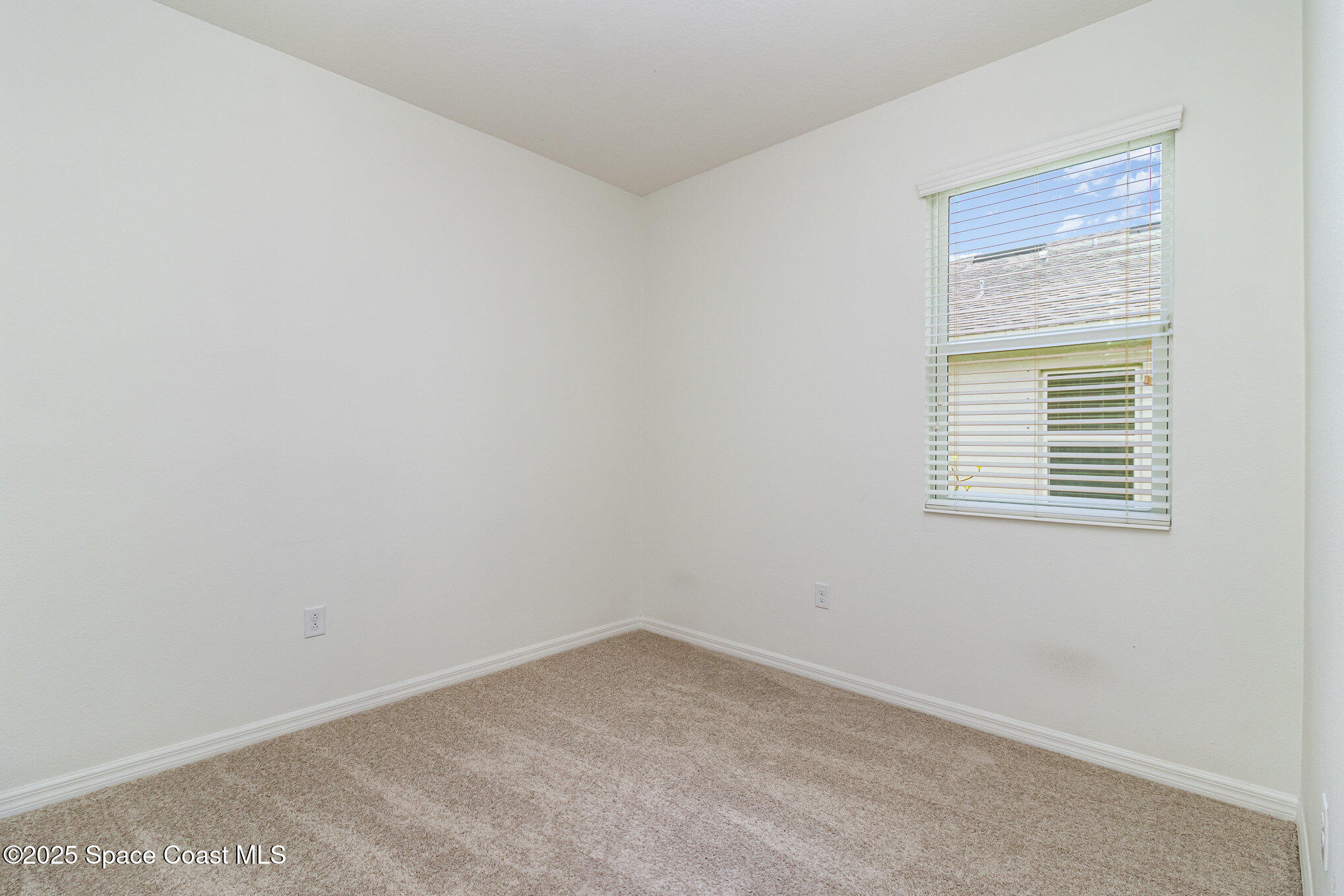 122 Port Royal Court Sebastian, FL 32958 - Photo 13 of 26 an empty room with a window