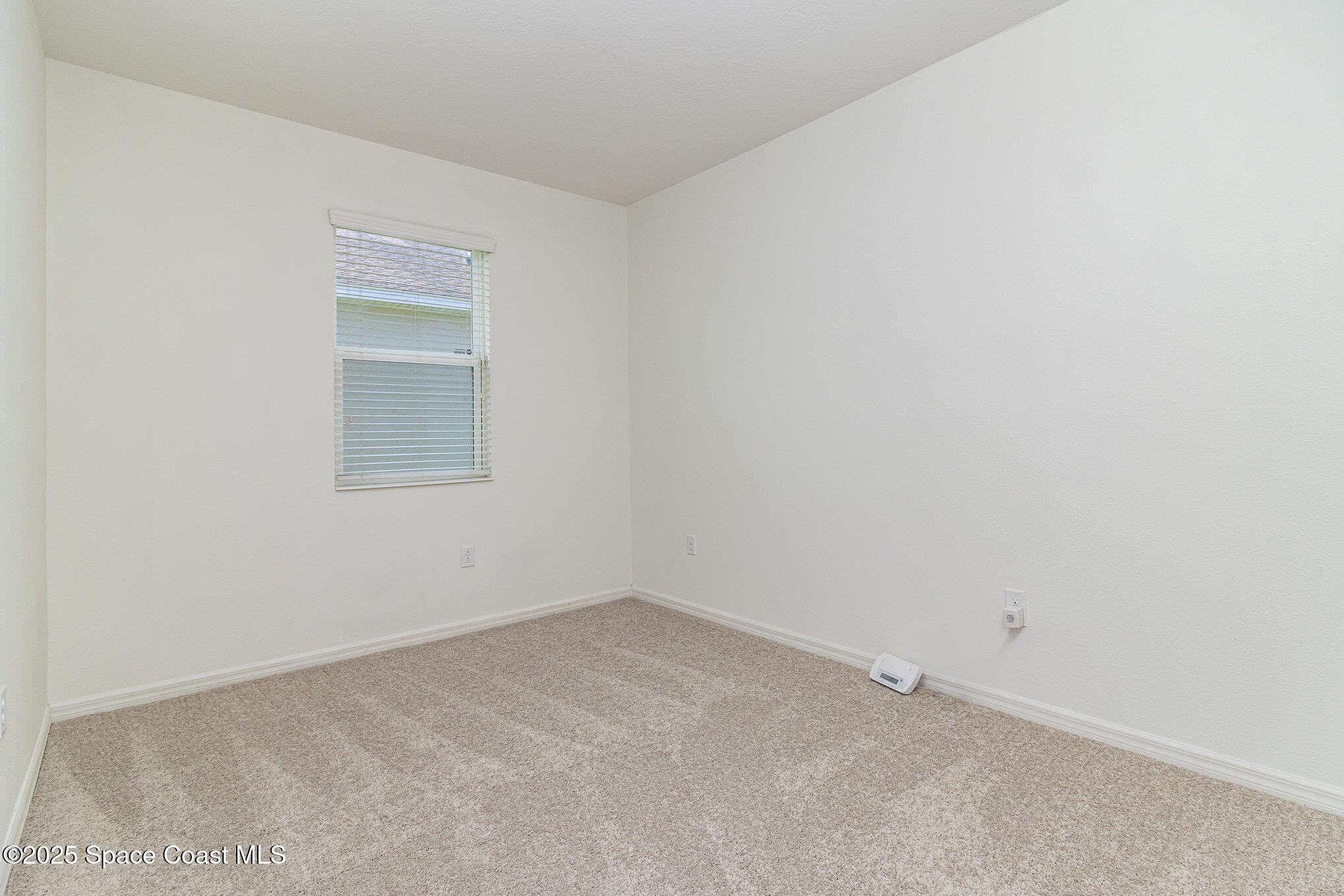122 Port Royal Court Sebastian, FL 32958 - Photo 15 of 26 a view of an empty room and a window