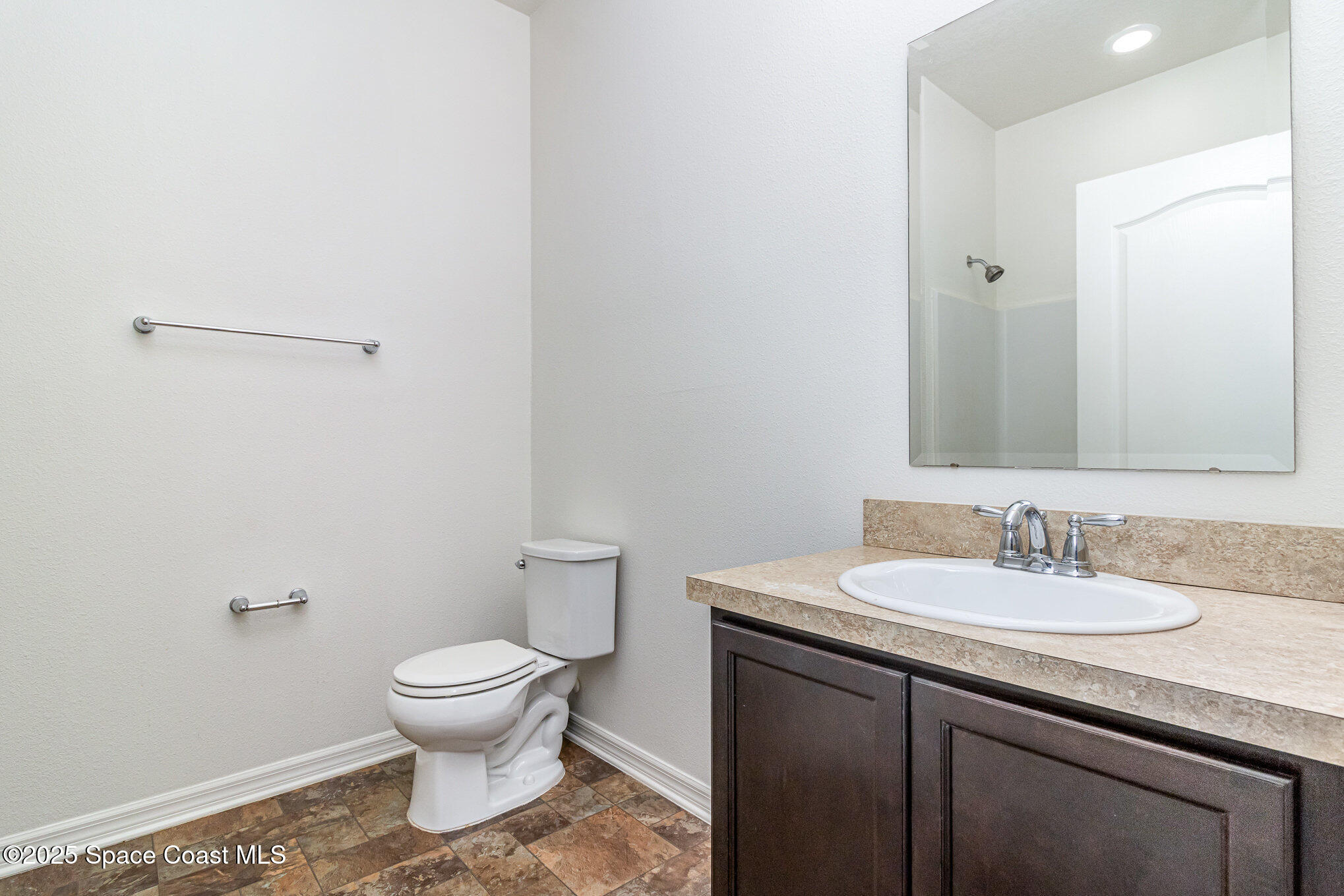 122 Port Royal Court Sebastian, FL 32958 - Photo 17 of 26 a bathroom with a sink toilet and mirror