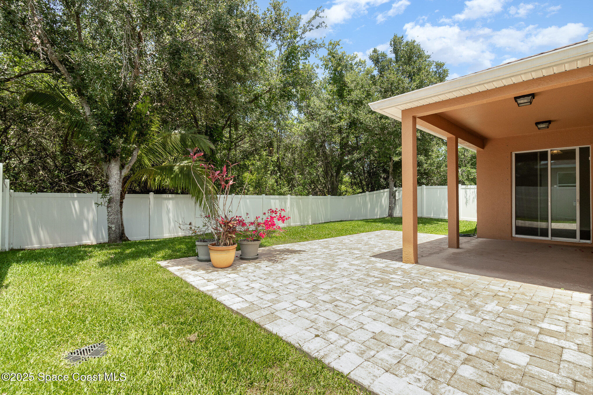 122 Port Royal Court Sebastian, FL 32958 - Photo 21 of 26 a view of a backyard with a small cabin and a chair