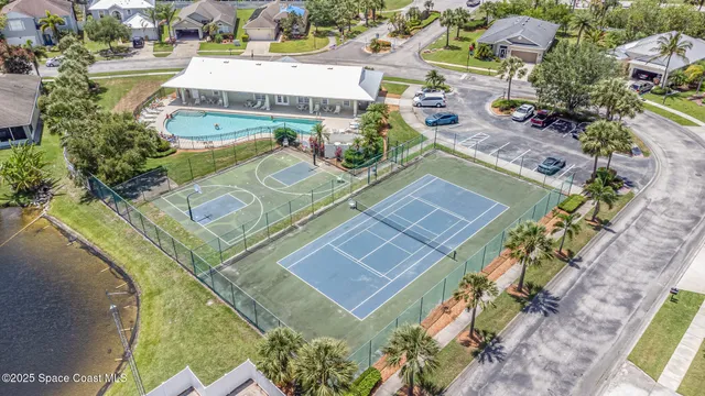 a view of a swimming pool with outdoor seating