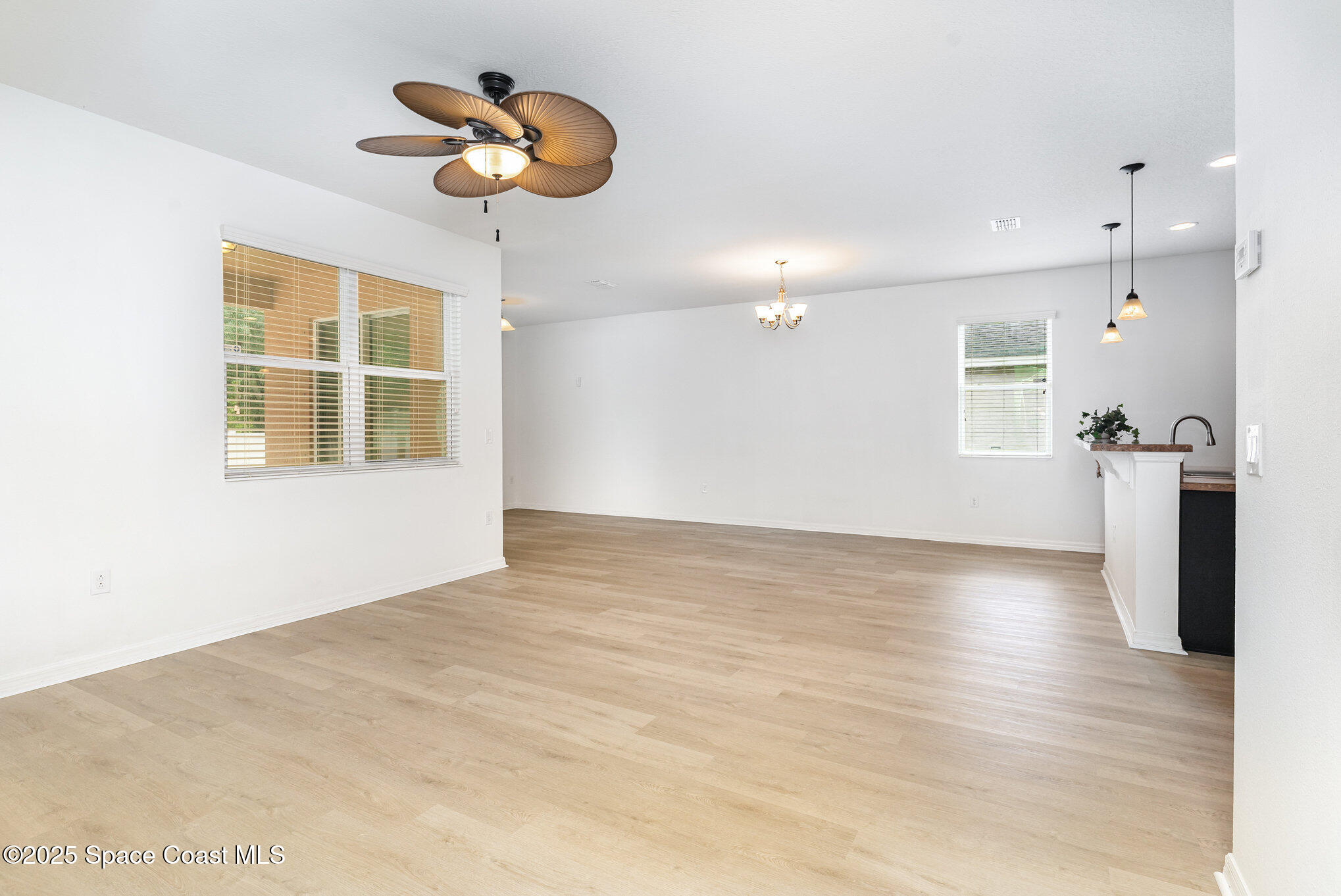 122 Port Royal Court Sebastian, FL 32958 - Photo 26 of 26 a view of an empty room with a window and kitchen view