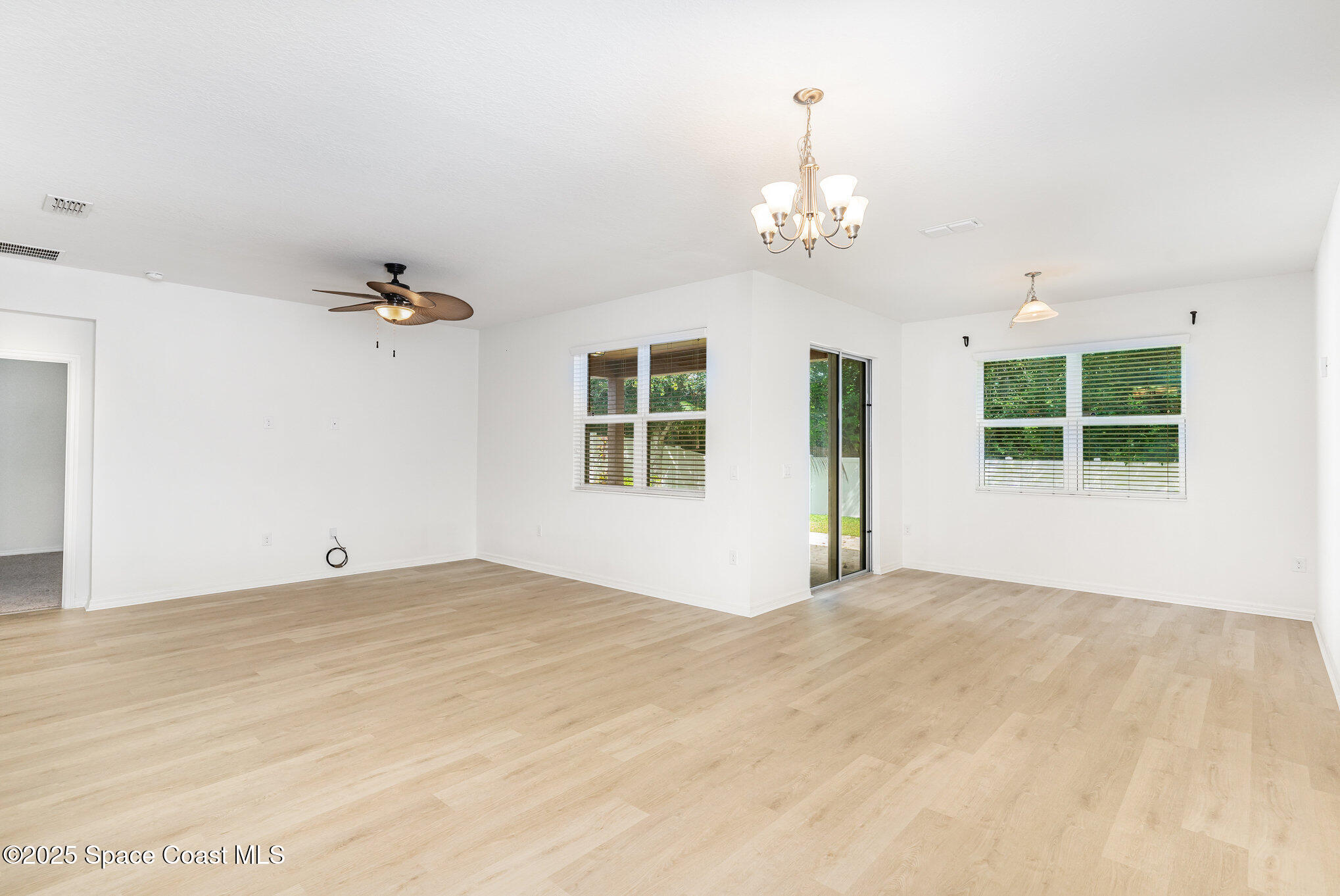 122 Port Royal Court Sebastian, FL 32958 - Photo 7 of 26 a view of an empty room with chandelier
