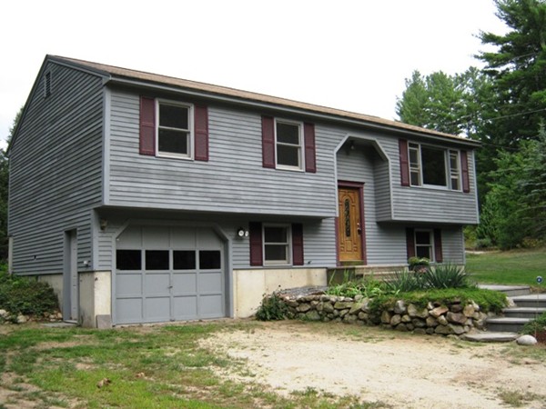 64 Colburn Road Milford, NH 03055 - Photo 15 of 17 a front view of a house with a yard