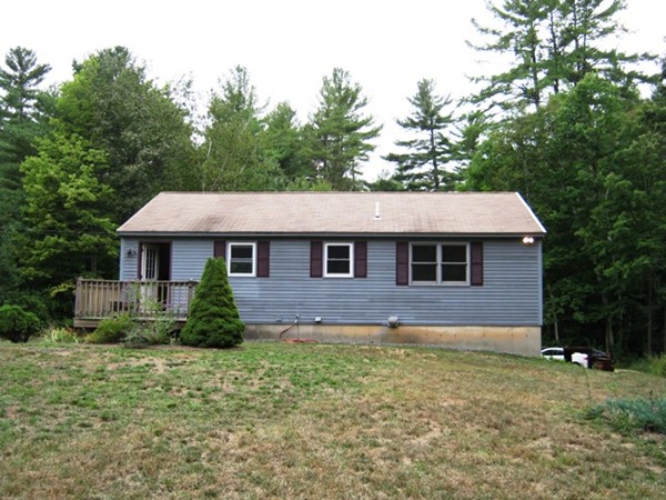 64 Colburn Road Milford, NH 03055 - Photo 16 of 17 a front view of a house with a garden
