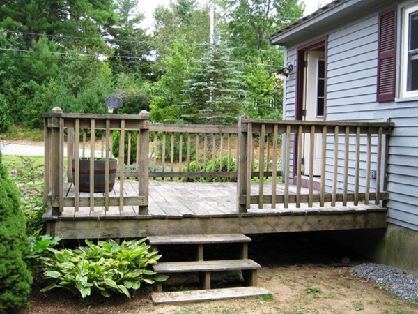 64 Colburn Road Milford, NH 03055 - Photo 17 of 17 a view of a balcony with chairs and wooden fence
