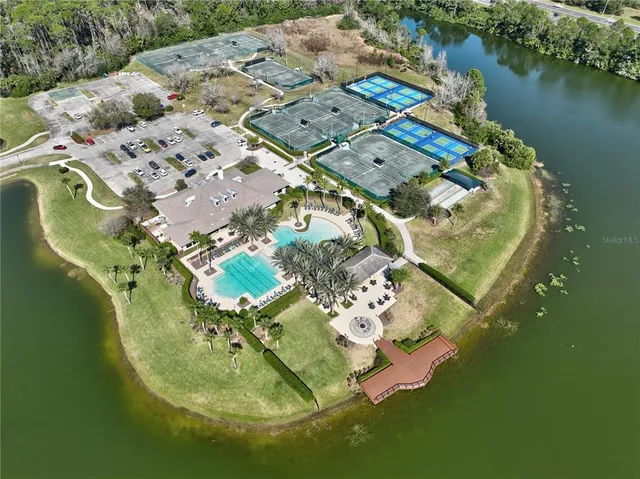 an aerial view of a swimming pool with outdoor space